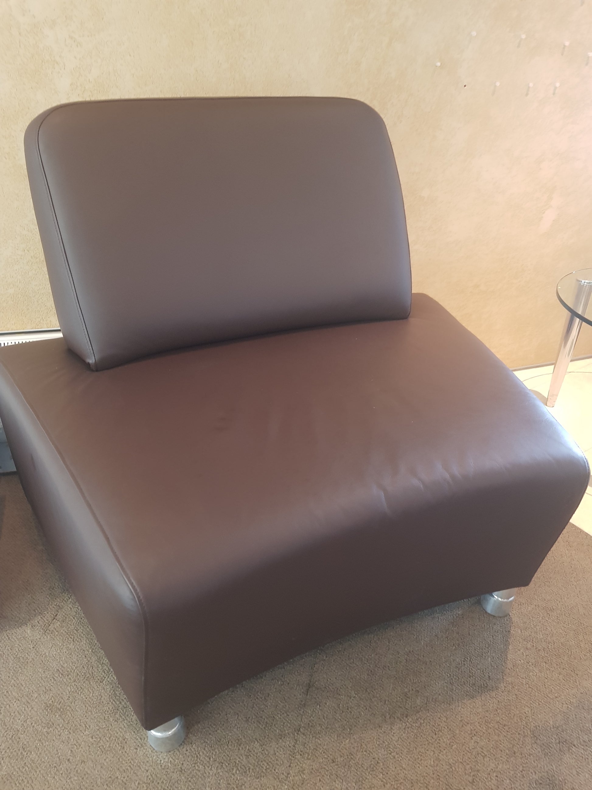 In the centre BOSS Design Single Executive sofa on right a glass table