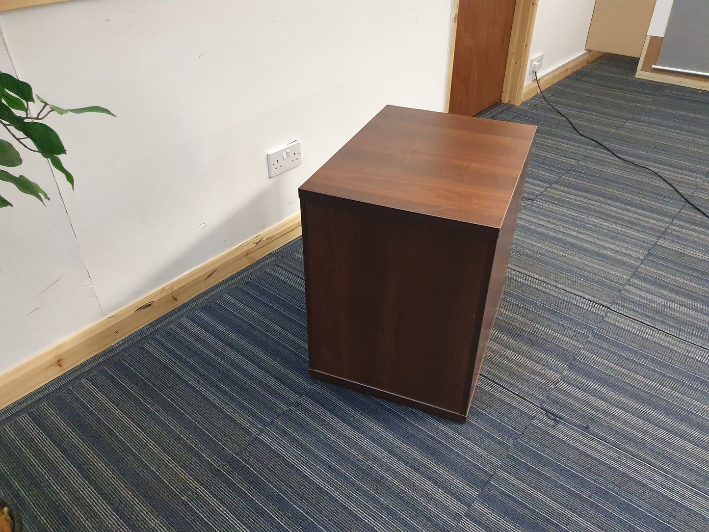 back of brown small filing cabinet