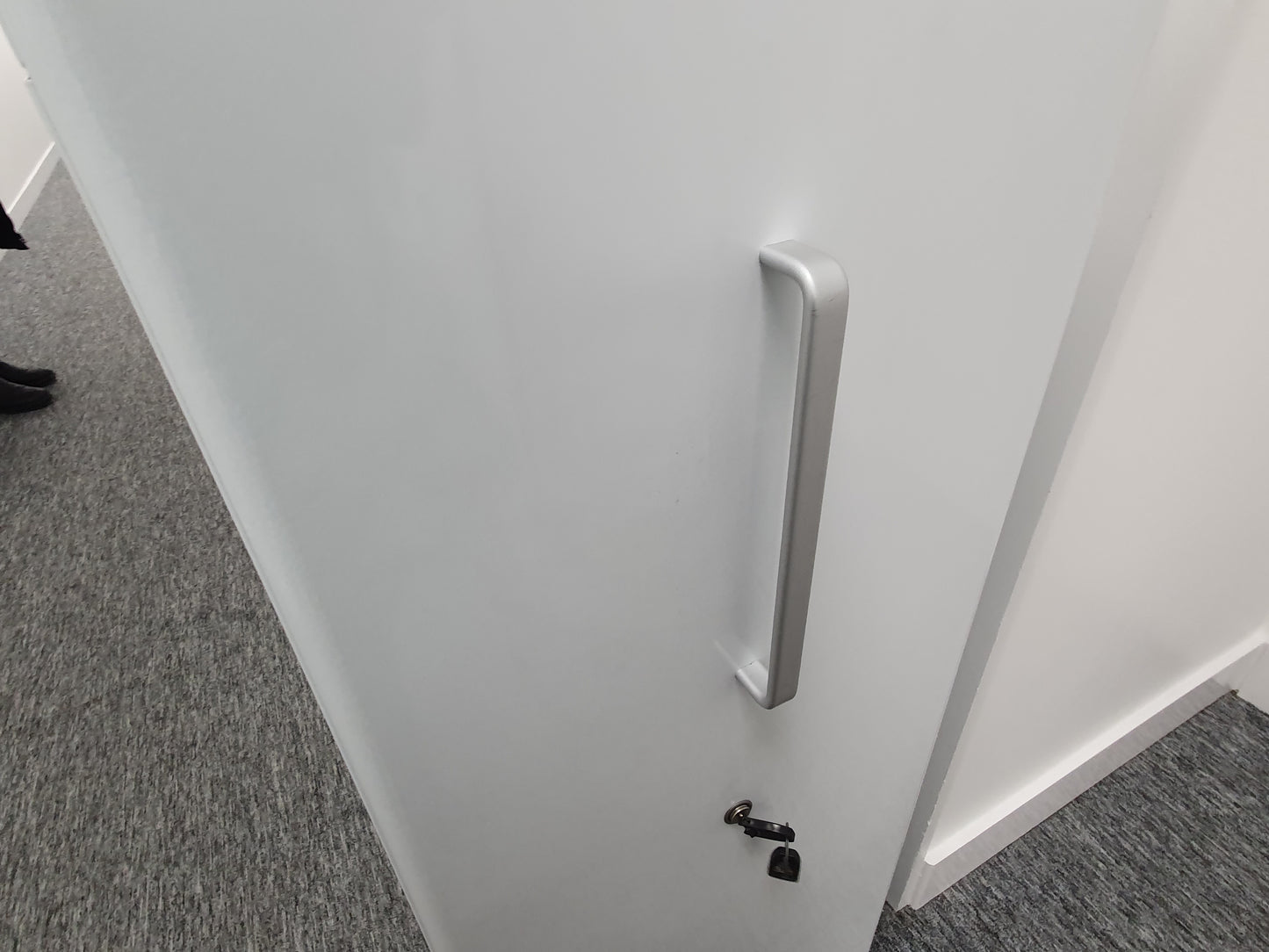 Silver Grey Handle Chrome on white cabinet front