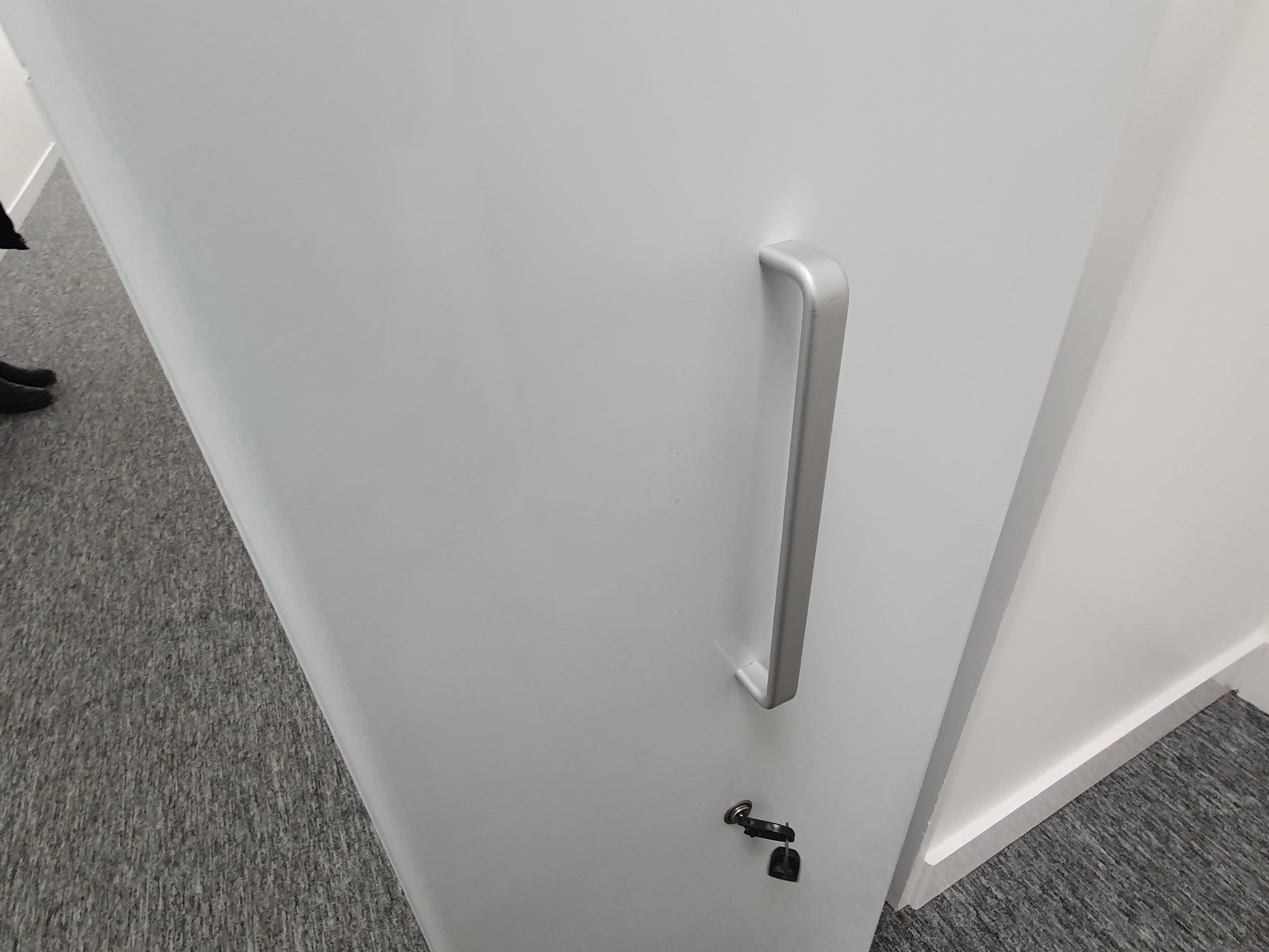 Silver Grey Handle Chrome on white cabinet front