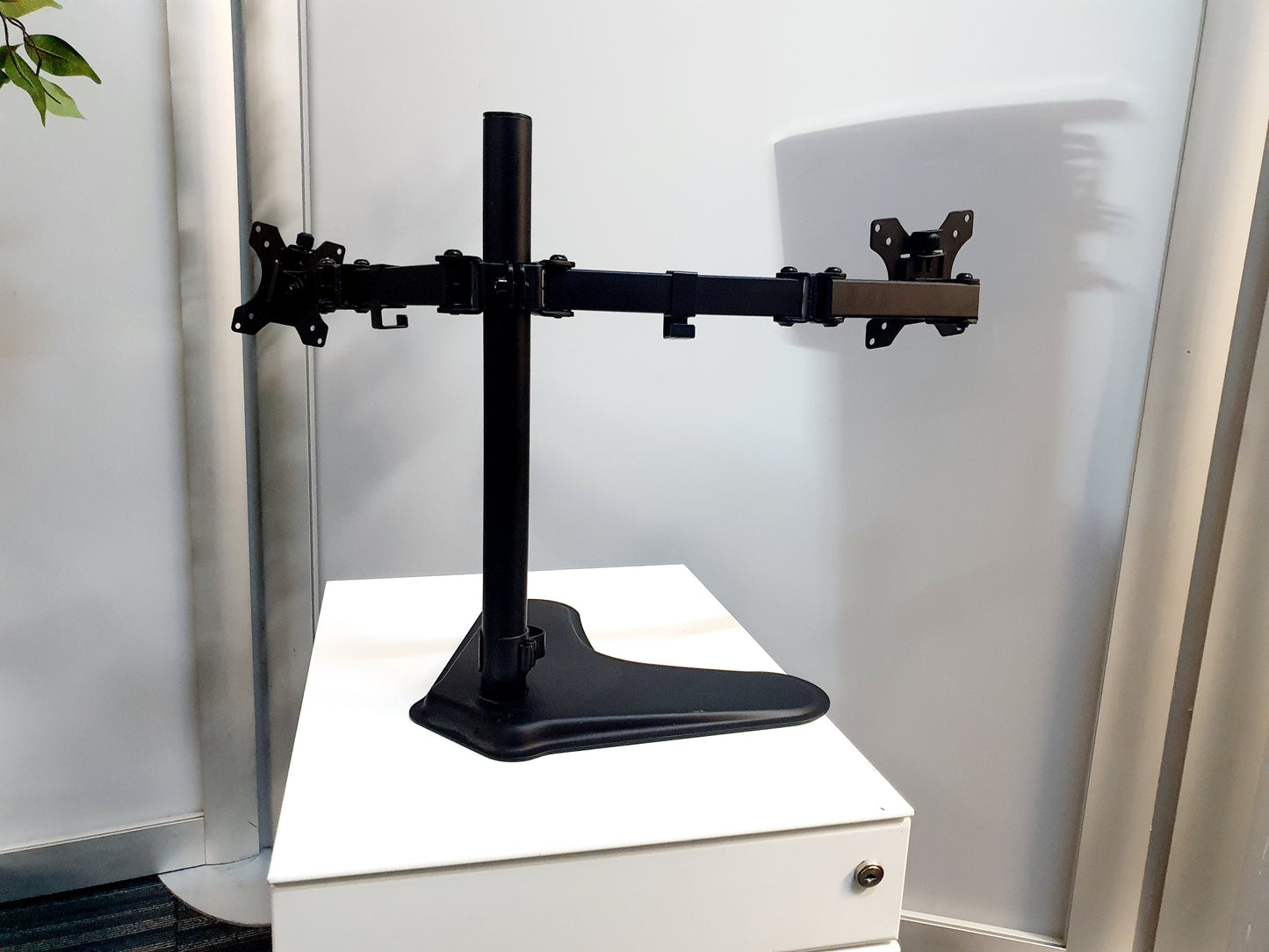 the back of an articulated Dual Screen Freestanding Monitor Arm
