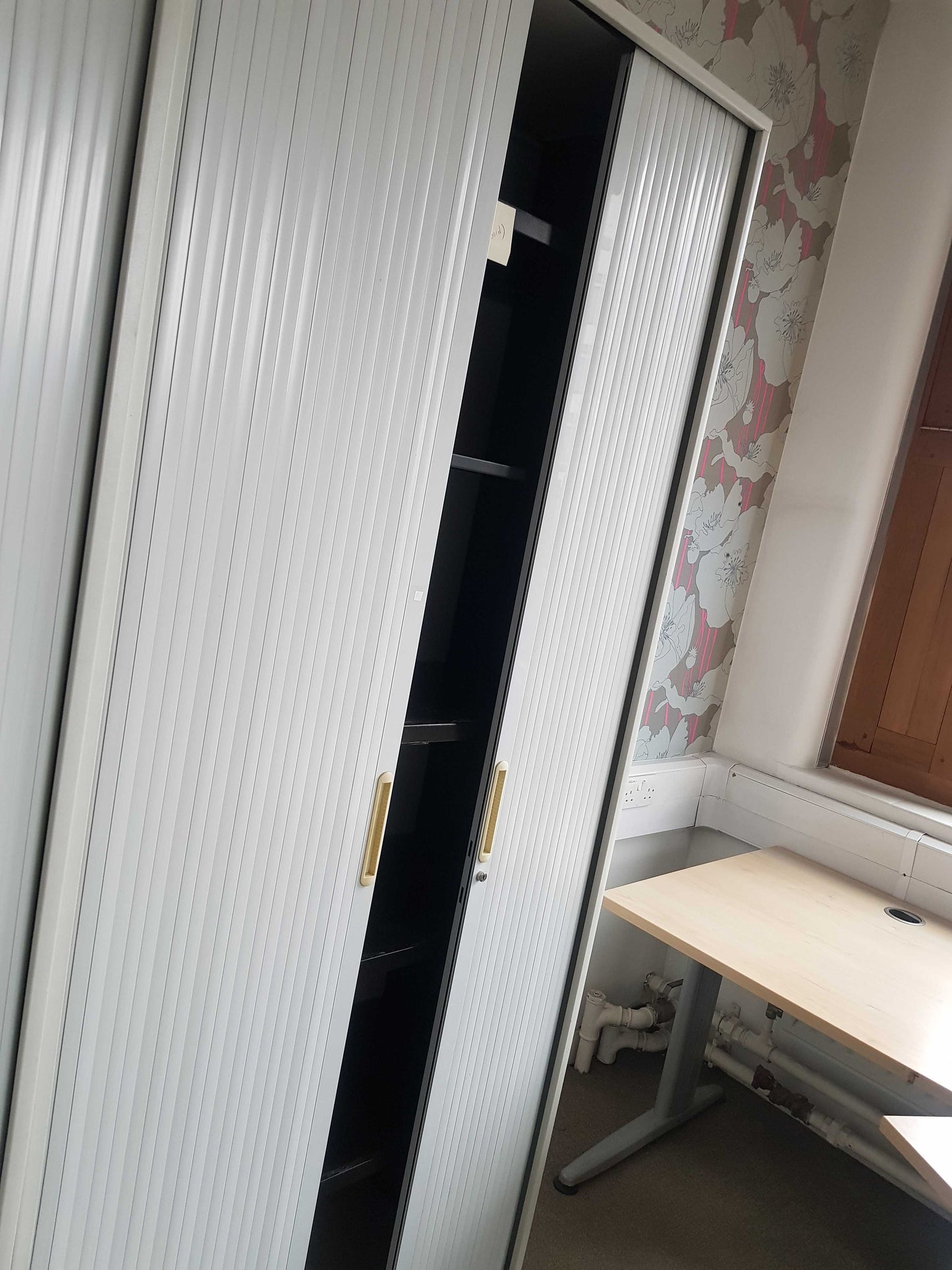 Used Tall Grey rolling door office cabinet, shelf tambour unit