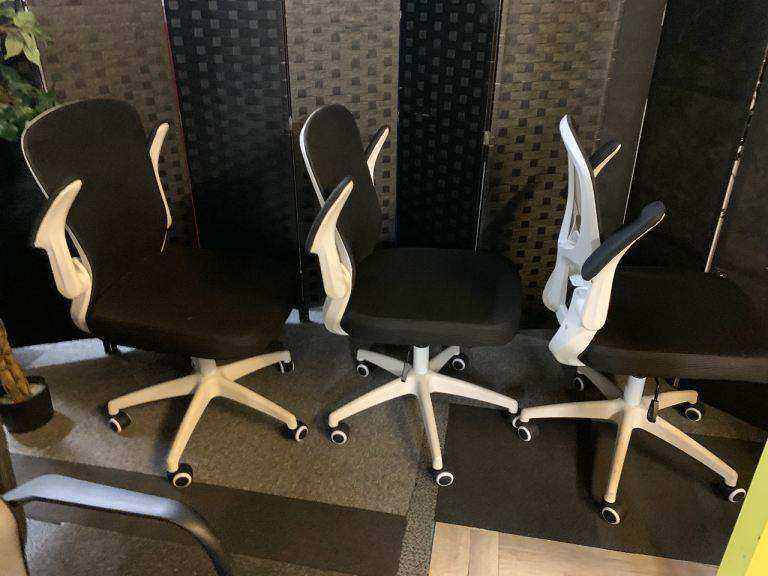 Used office adjustable swivel chair with back support Black and white contrast