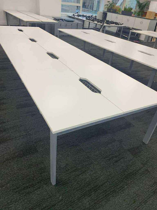 Used white 8 person Pod bank/bench desk with central port cable management 160cm x 80cm per desk