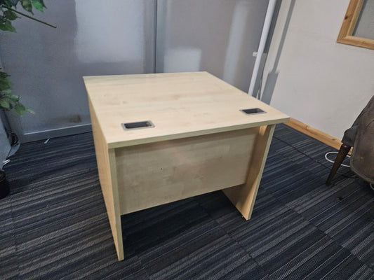 Brown small office desk on carpet
