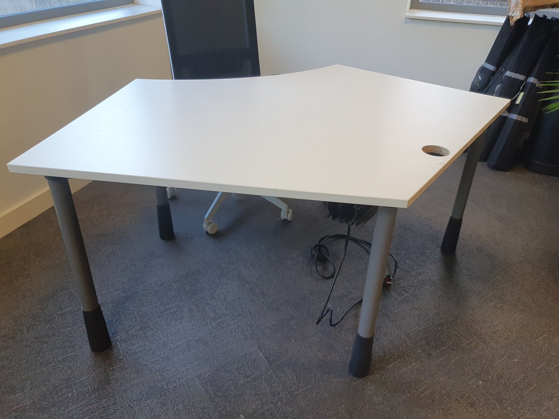 Black desk chair at white office managerial workstation