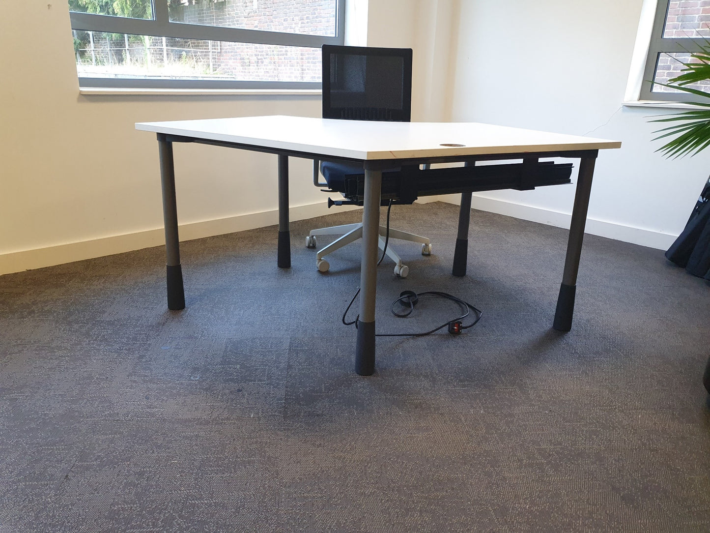 Black desk chair at white office table