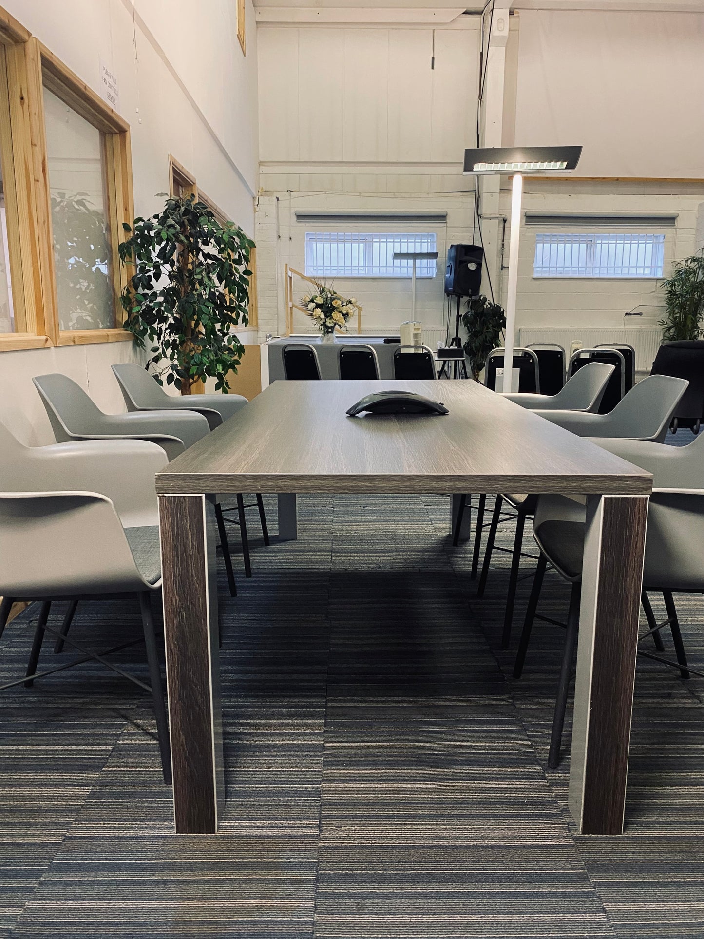 Walnut table with grey and black chairs