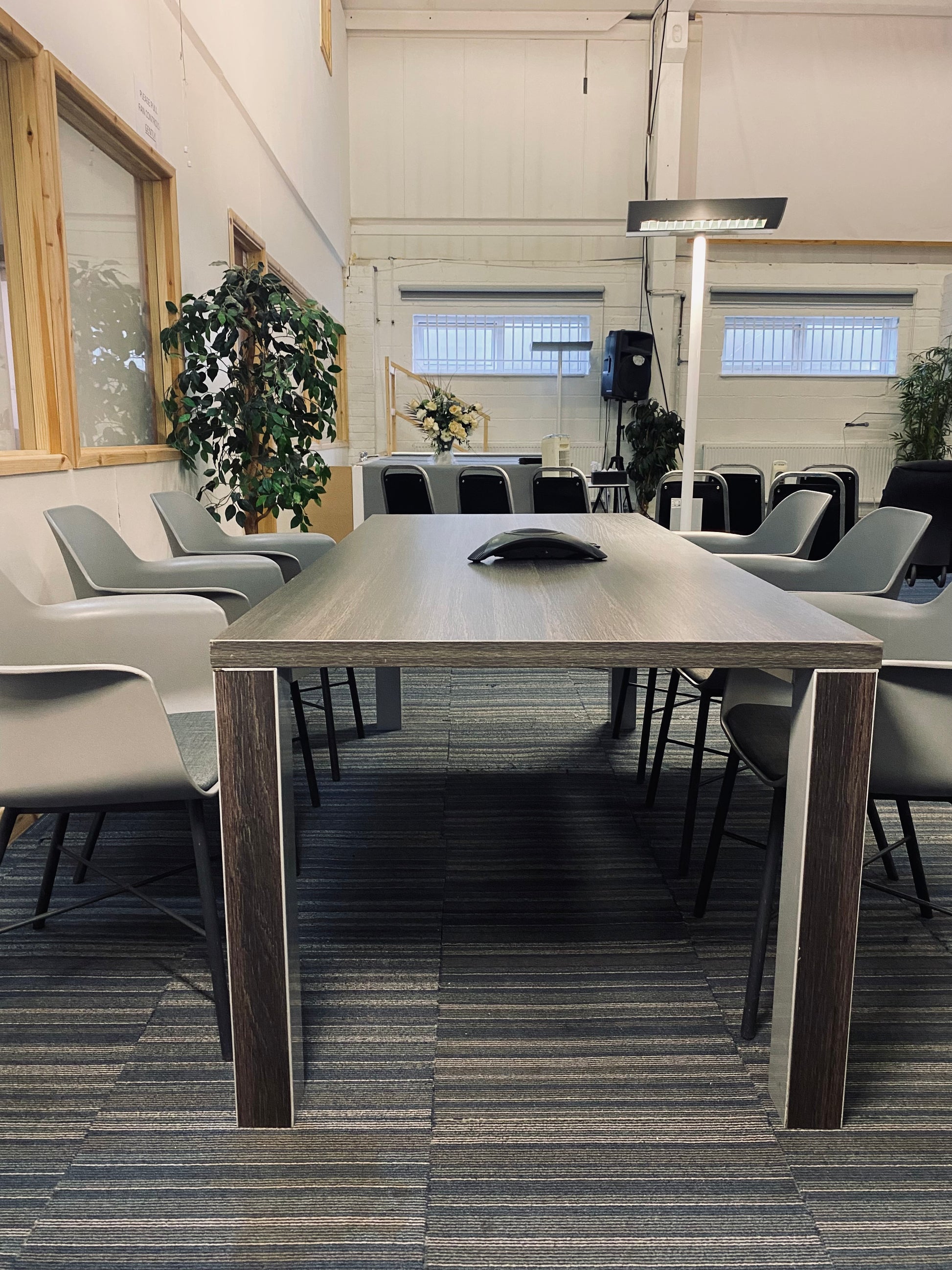 Walnut table with grey and black chairs