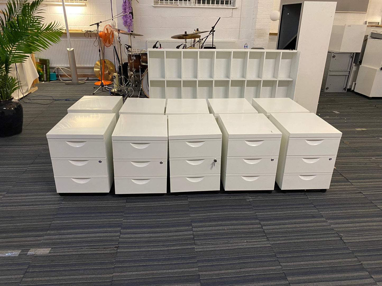 Left, tall green plant, centre, ten office under desk drawers by IKEA