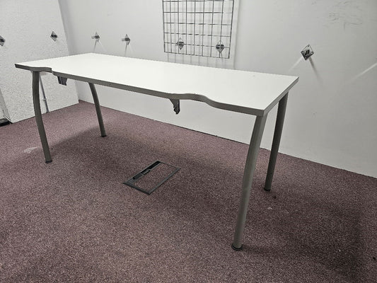 White narrow office desk on carpet