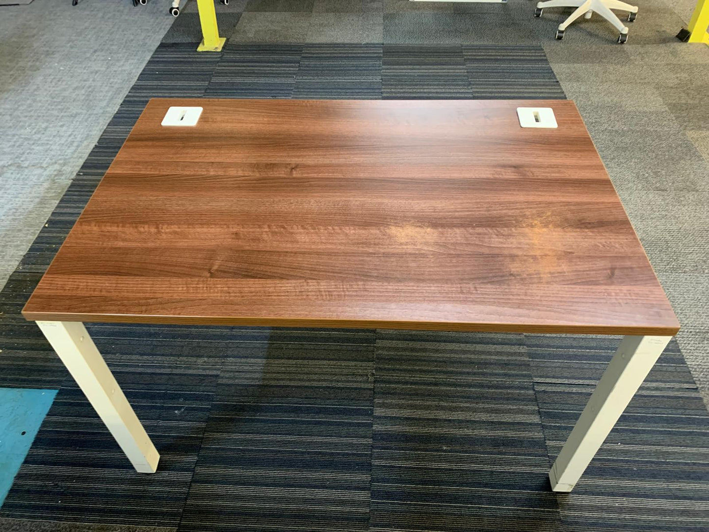 Walnut finish study desk with contrasting white legs and modesty panel