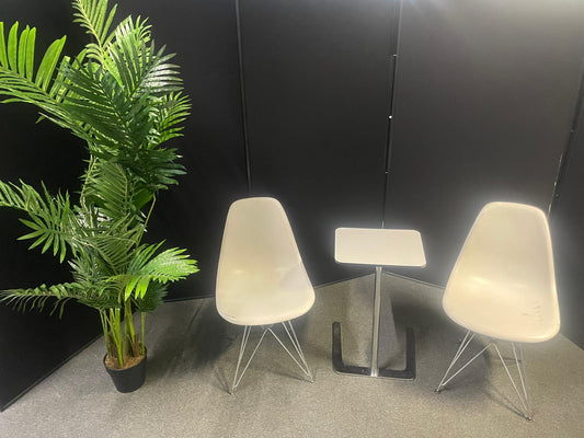 Used Eames Plastic Side Chair DSR by Vitra features a white polypropylene shell and a distinctive chrome "Eiffel" wire base
