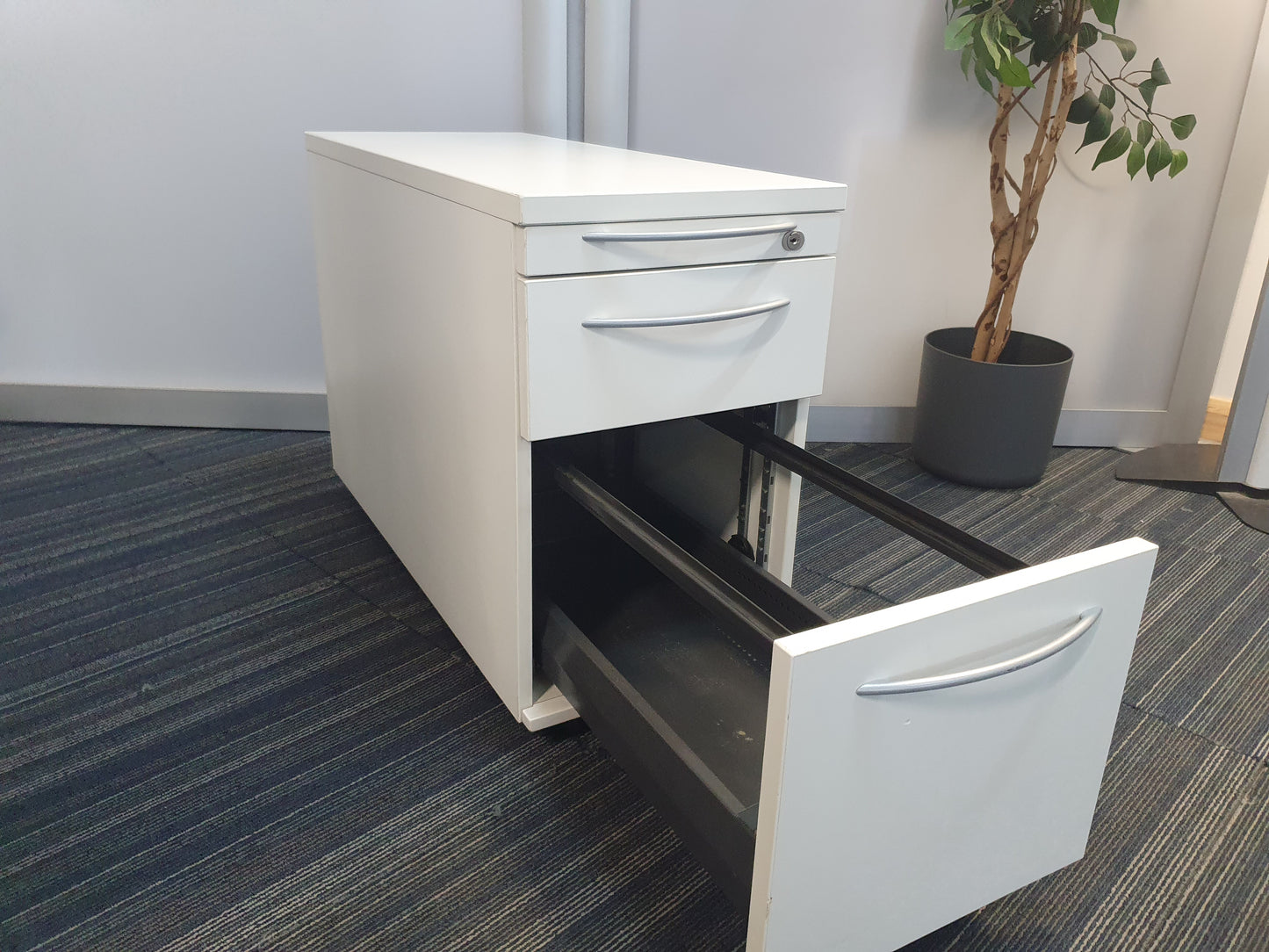 Narrow under desk office drawer with open bottom filing drawer