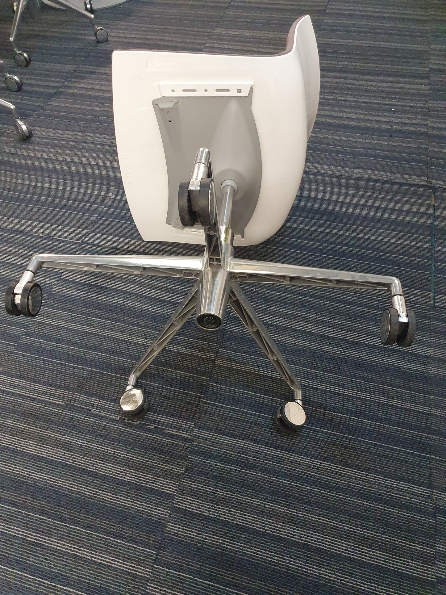 Underside of Arper Catifa Swivel Chair on castors