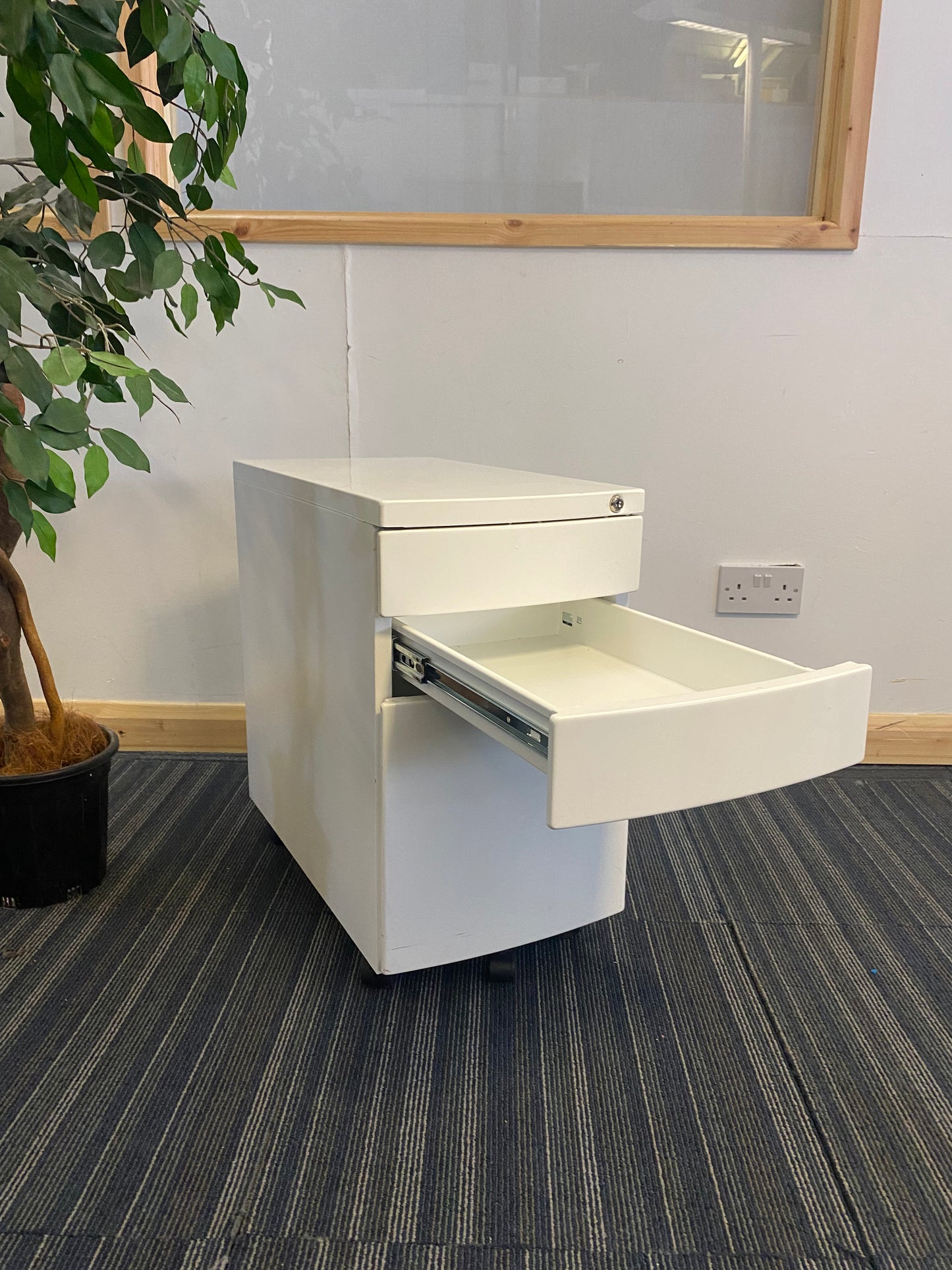 Left, tall green plant, centre, White filing drawer