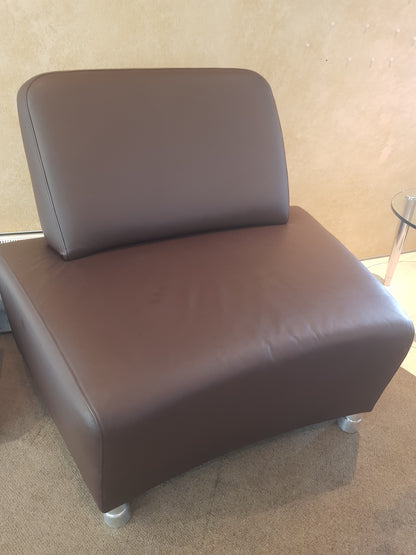 In the centre BOSS Design Single Executive sofa on right a glass table