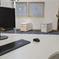 Samsung SyncMaster B1940W monitor on corner table in front of 3 office drawers