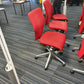 Red Swivel Office Chair by Orangebox on castors - no arms