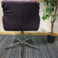 Back of purple chair on swivel chrome leg