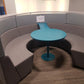 a grey Connections Flock Modular Circular Meeting Booth on carpet