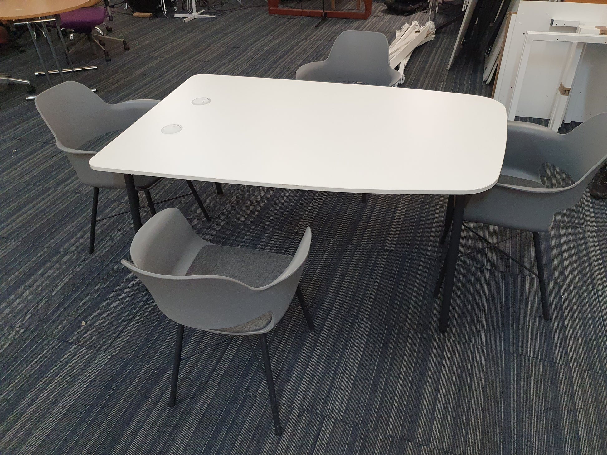 White 5 seater meeting table and grey dining chairs