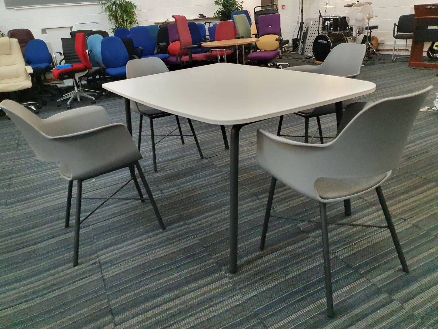 White office meeting table in a room of furniture