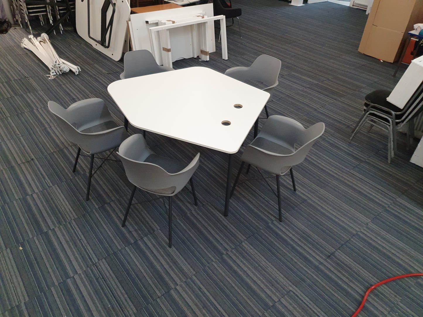 White meeting table in large room 