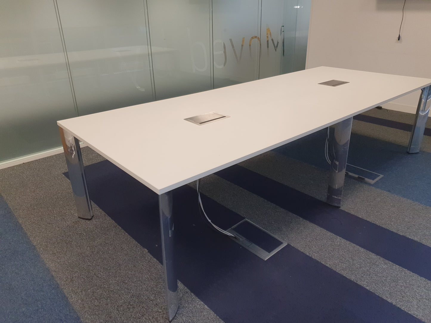 White meeting table and silver chrome legs