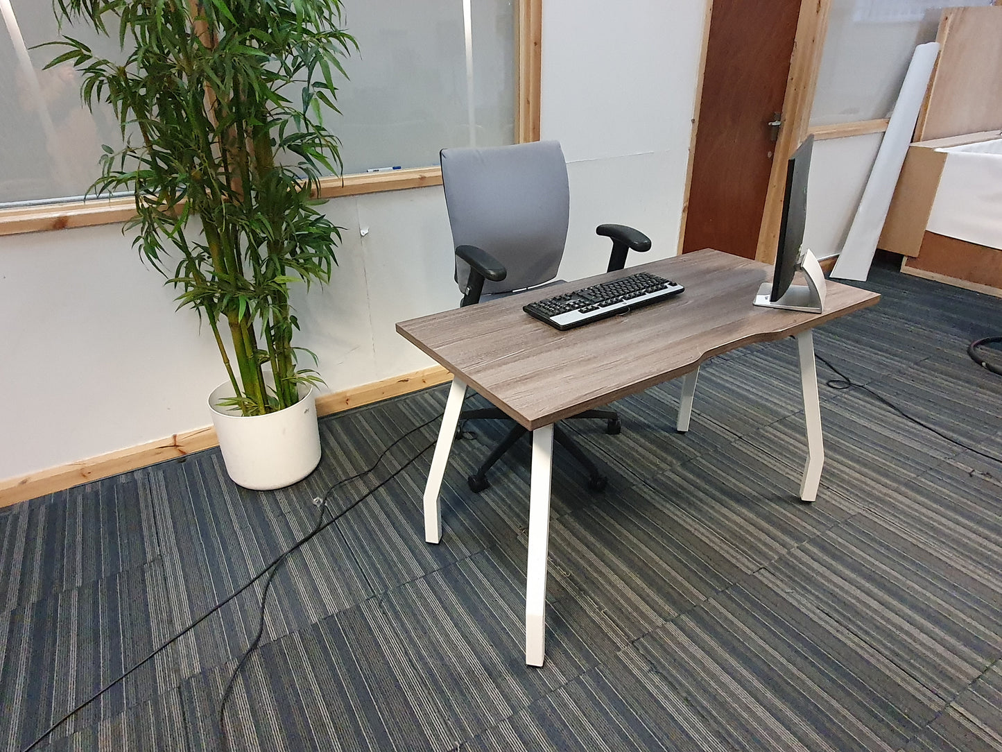 Brown office desk in large room