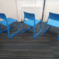 Back of three blue chairs