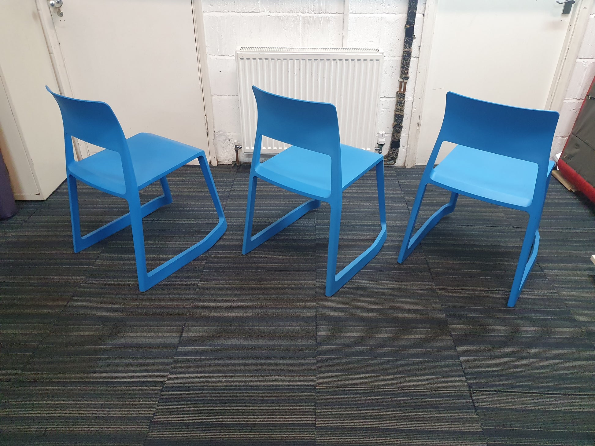 Back of three blue chairs