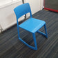Blue cantilever chair on carpet