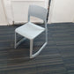 Light blue cantilever chair on blue carpet