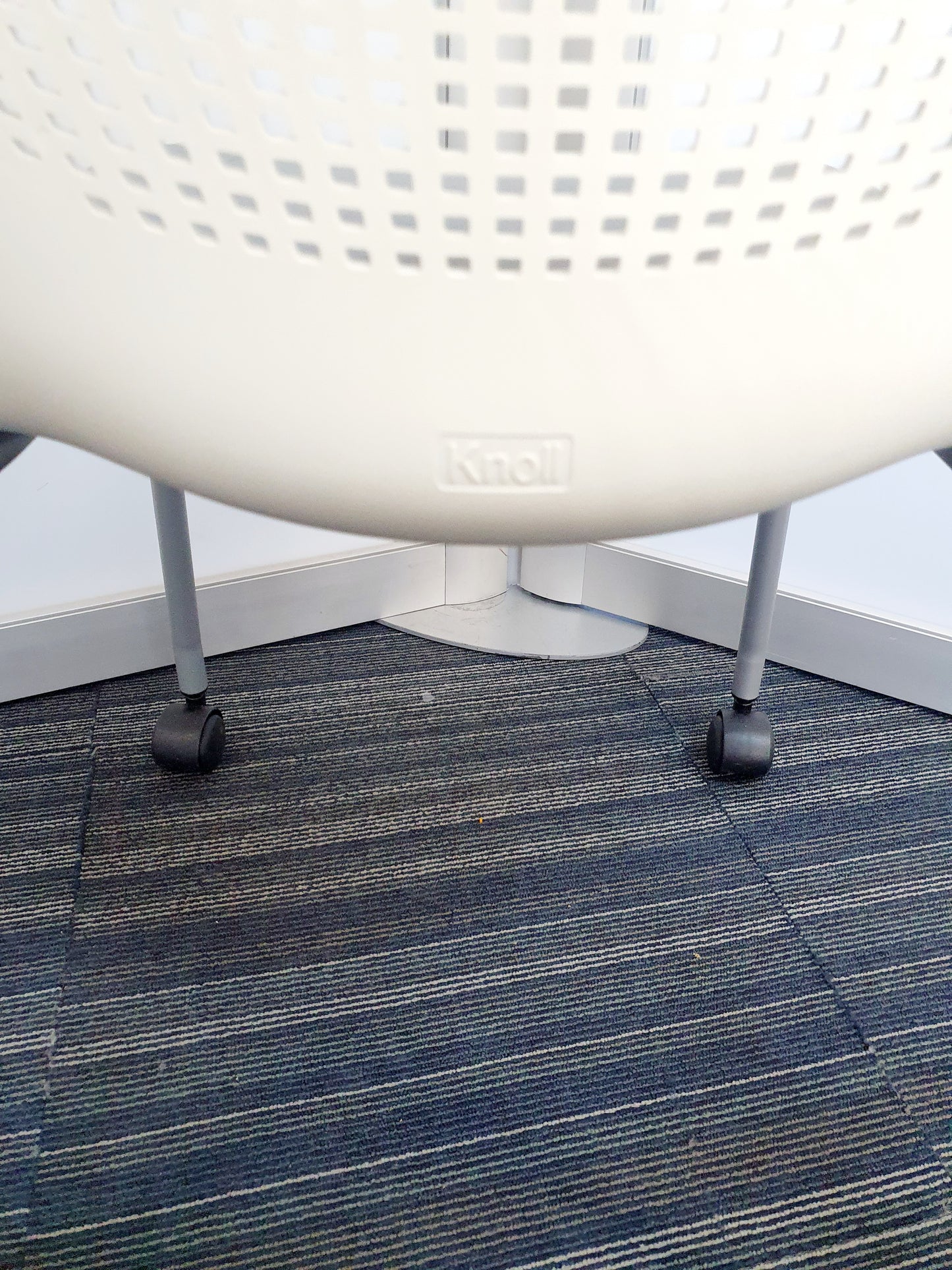 Knoll label on white chair