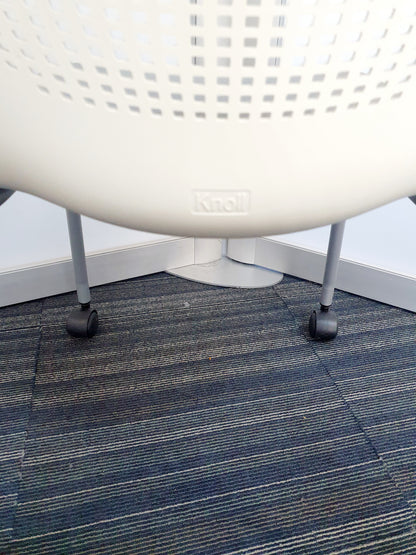 Knoll label on white chair