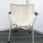 Back of perforated white stackable meeting chair