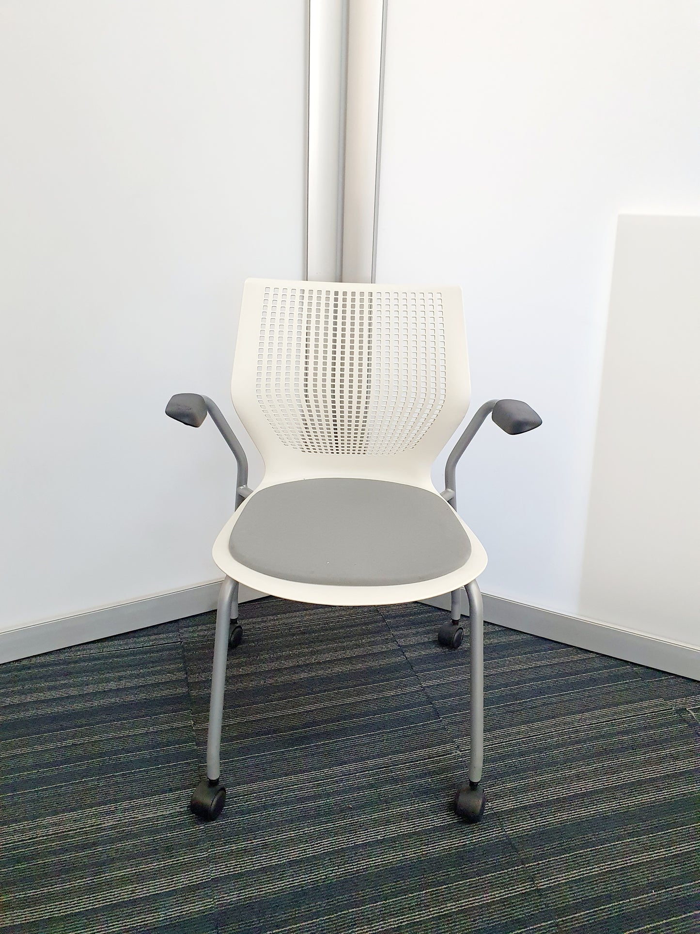 White meeting chair with wheels