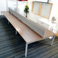 walnut office bench desk 6 seater in front of two windows