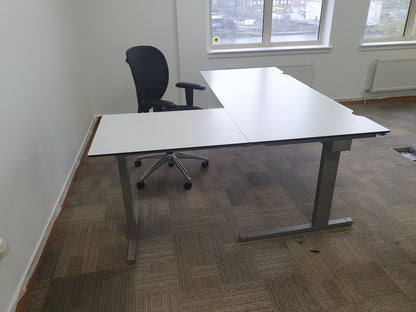 White computer office desk and black swivel operator chair