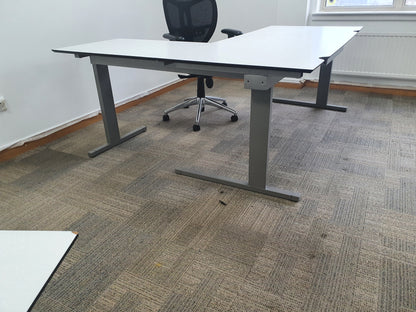 Grey legs on white office table
