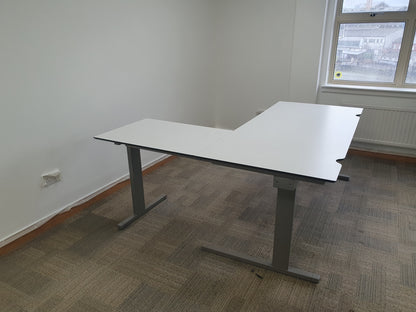 Clear white workstation in office corner