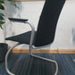 Black chair and grey frame on cantilever fabric chair