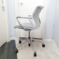 Side of white and grey office wheelie chair