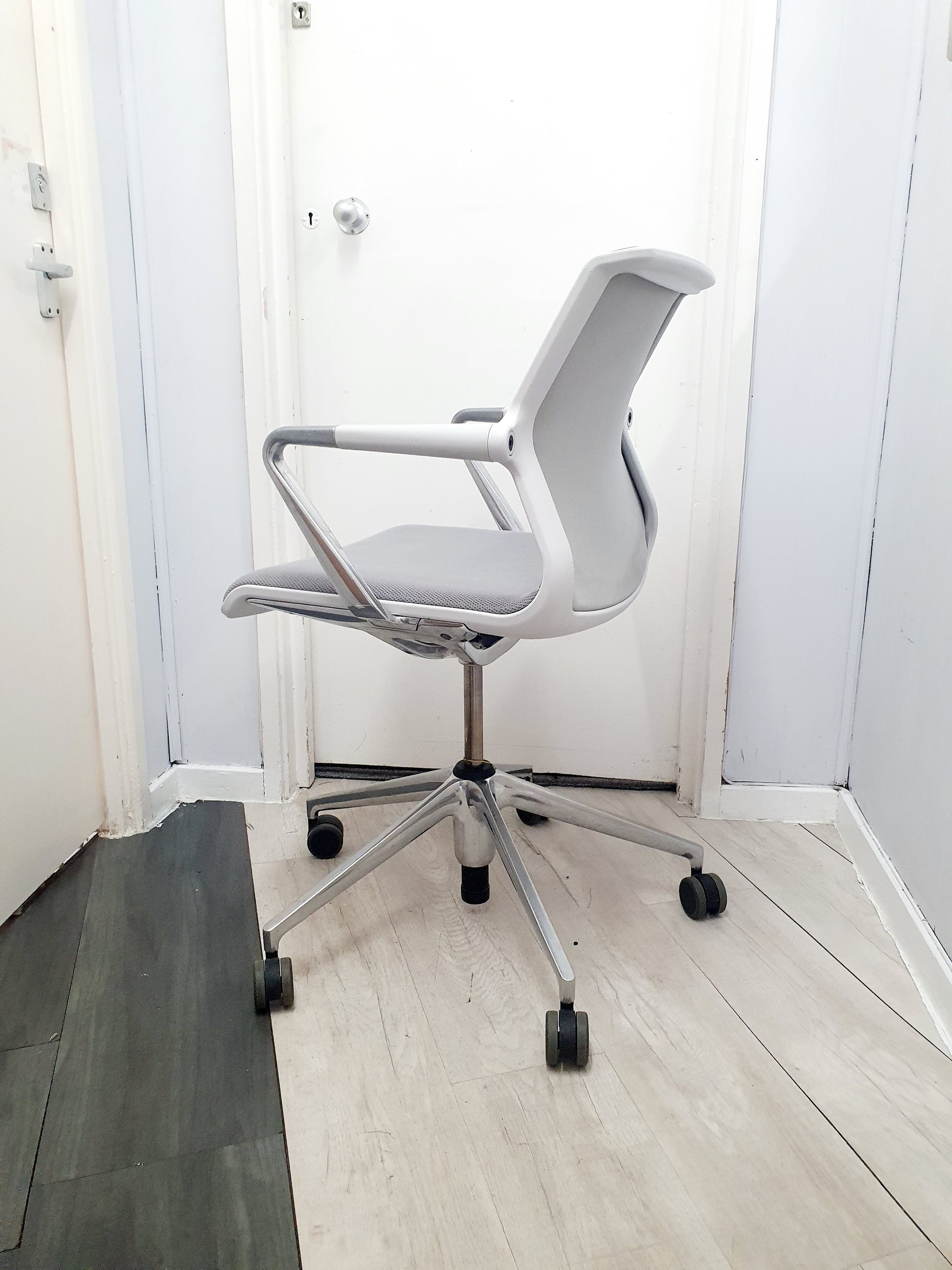 Side of white and grey office wheelie chair