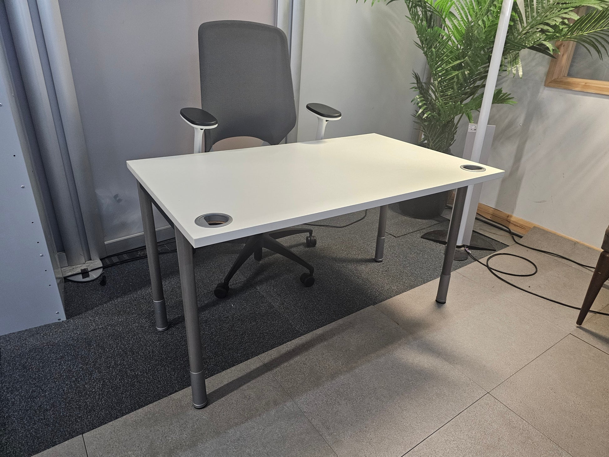 Grey desk chair at White office desk 