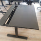 Black height adjustable office table