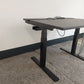 Black legs of height adjustable office desk