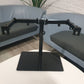 Freestanding Dual Monitor Stand with Sleek Glass Base and Adjustable Arms