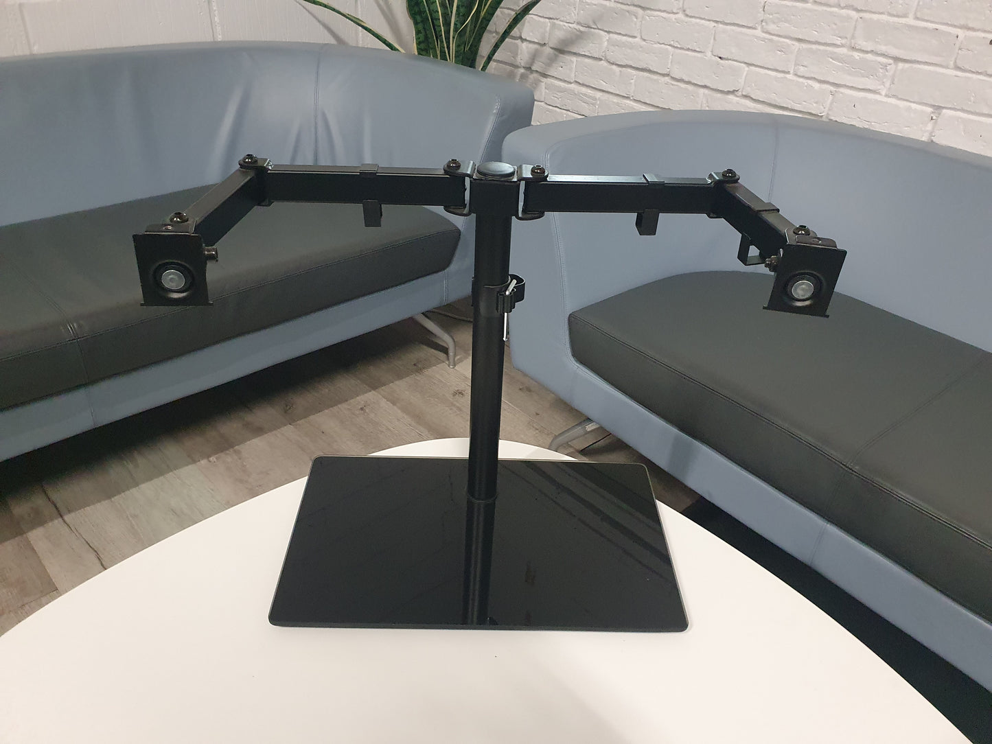 Freestanding Dual Monitor Stand with Sleek Glass Base and Adjustable Arms